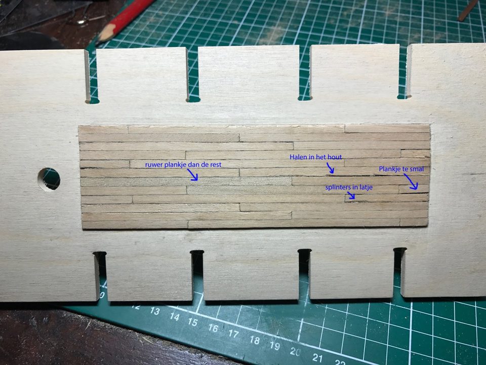 The trial deck with the problems marked: a rougher plank, scratches in the wood, splinters and a strip that is too narrow.