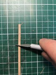Scraping with a new blade: testing the grain and smoothing the plank