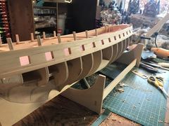 Masking tape protects the deck while sanding