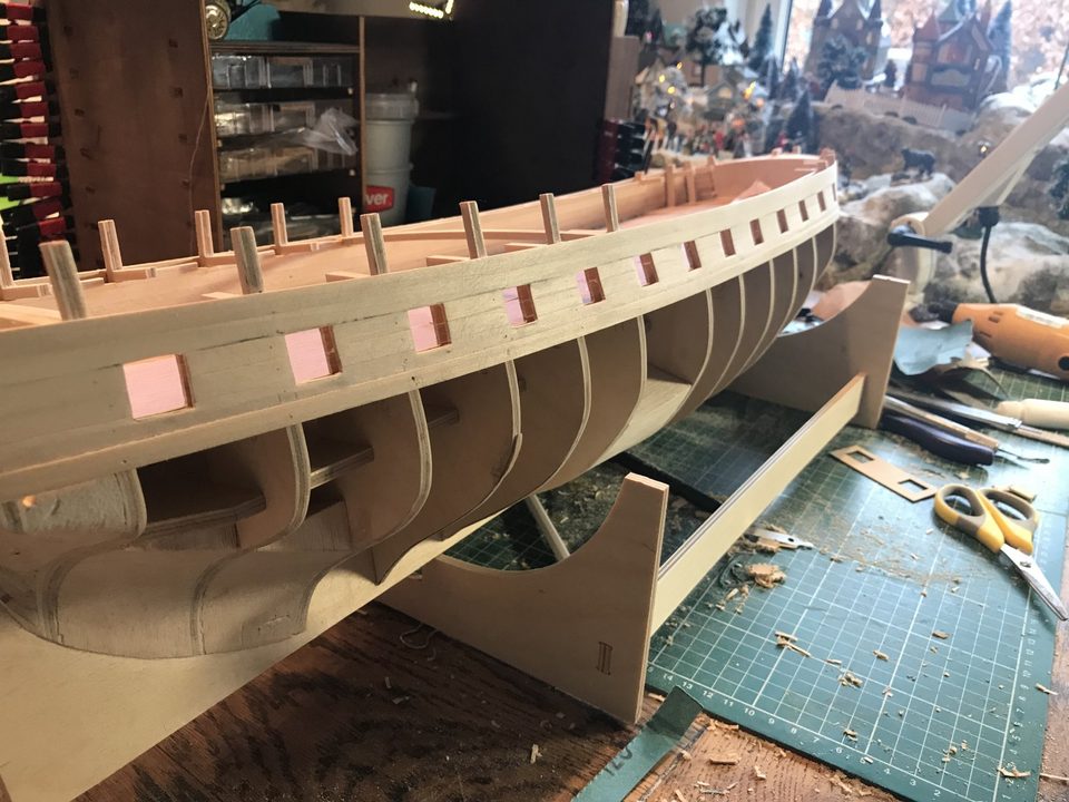 Masking tape protects the deck while sanding