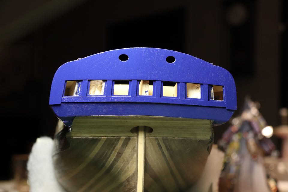 The transom with open window holes: through each hole you see the structure behind.