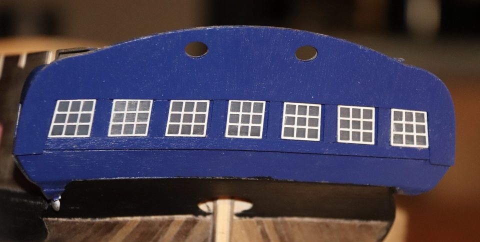 With flash: the glue marks behind a few panes become visible.