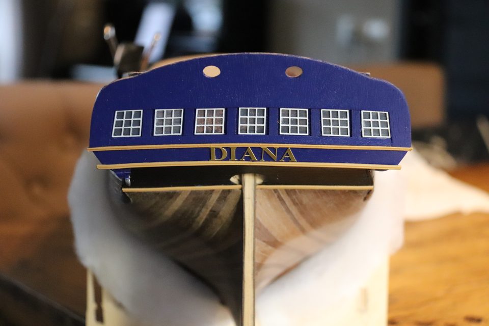 The name in brass on the transom