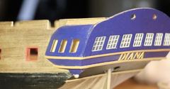 The decorative strips continue from the transom onto the gallery