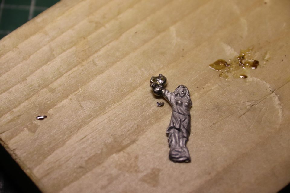 During surgery: a blob of solder on the arm, much bigger than the final shape.