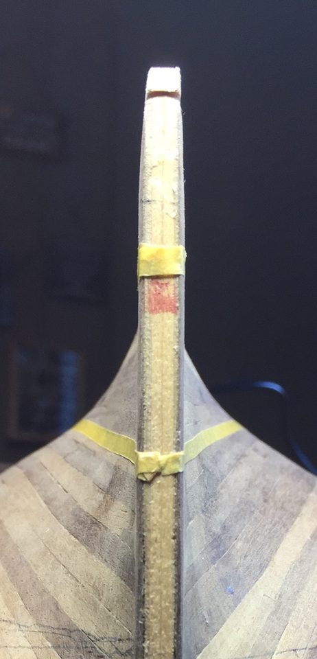The same belt seen from astern: on either side of the sternpost the tapes come out at the same height.