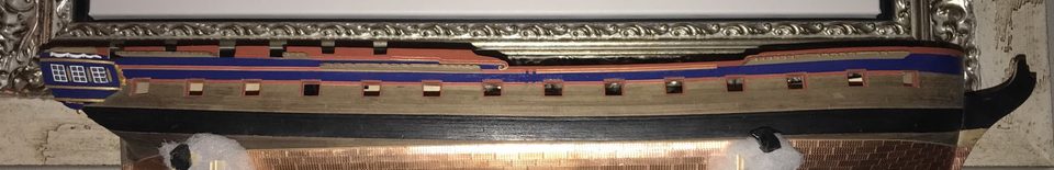 Starboard aft, with the mouldings on the blue band