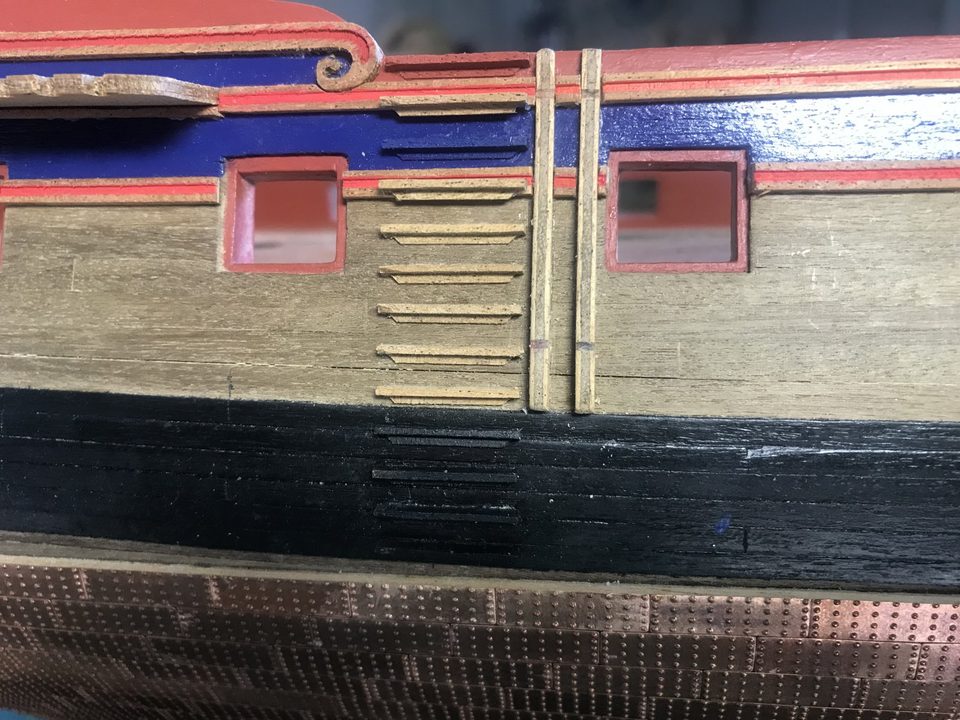 The steps in the colour of the hull behind them