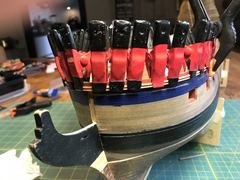 The top moulding at the bow, with a row of clamps