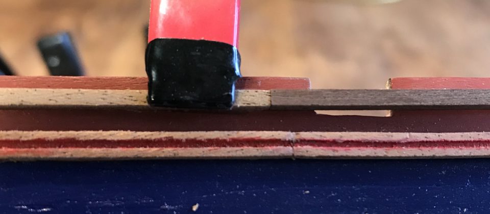 The walnut supplied next to the laser-cut moulding: a big colour difference