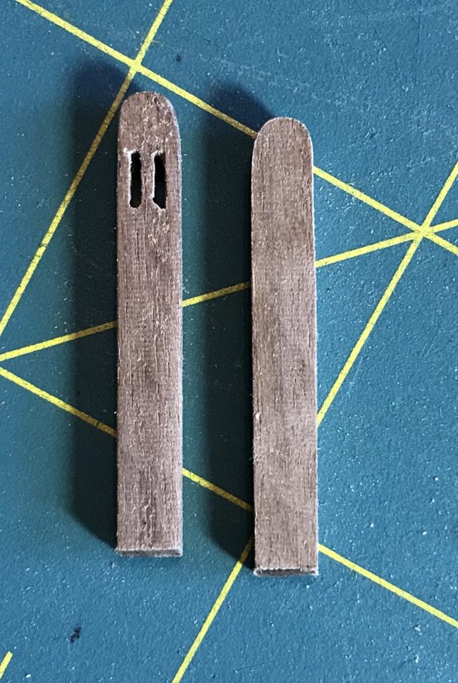 Left, the cathead with the two slots already cut in the head; right, the uncut blank.