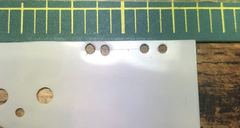 The template of stencil plastic with two pairs of holes