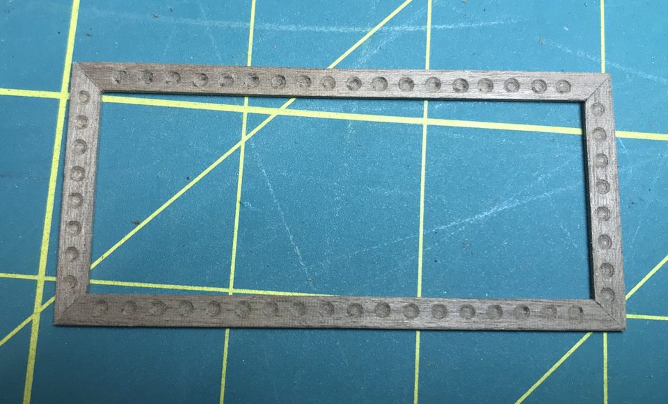 The frame assembled: a rectangle of strips with the hollows all round.