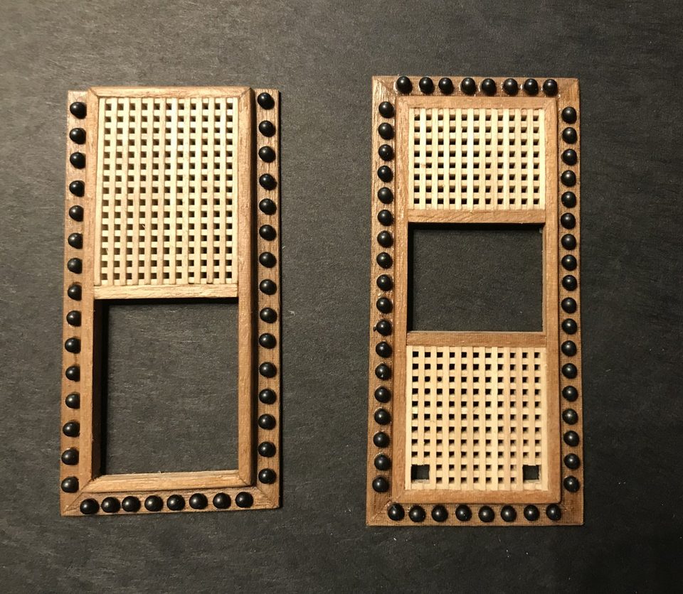 Two shot garlands around the gratings, the shot just laid in the still-wet varnish.