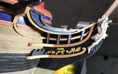 Gold carvings and the gold line on the blue trim pieces