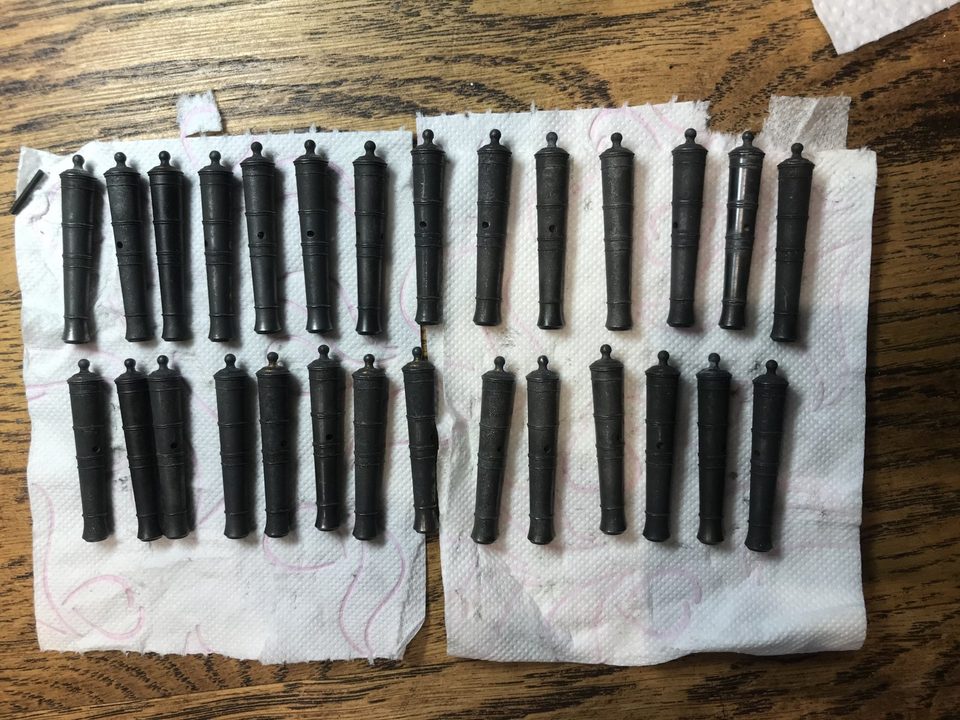 The 28 blackened barrels on kitchen paper: the same treatment, clearly different shades.