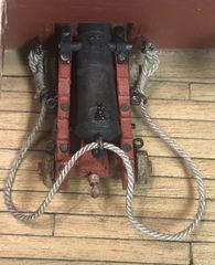 The first breeching rope, still at trial height on the ship's side