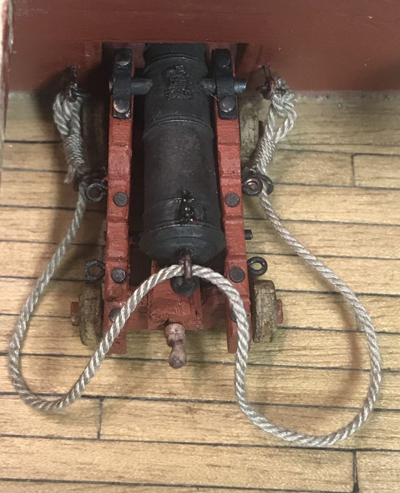 The first breeching rope, still at trial height on the ship's side