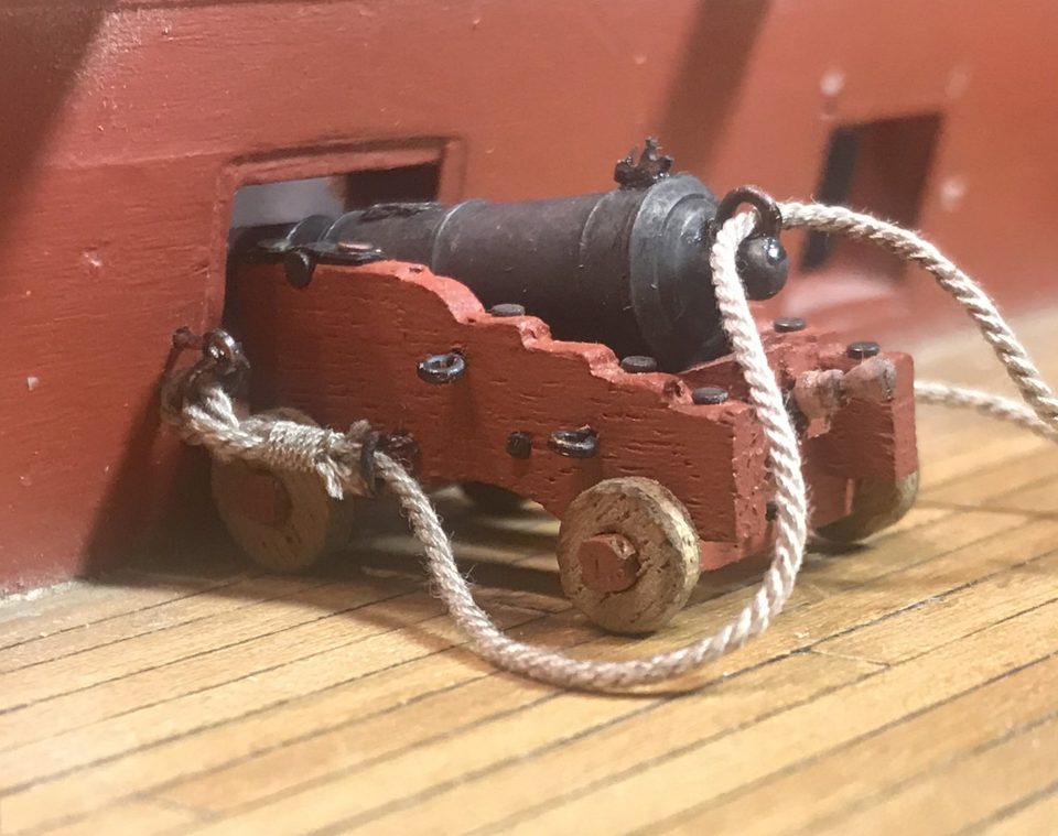 The knot of the breeching rope at the ring on the barrel