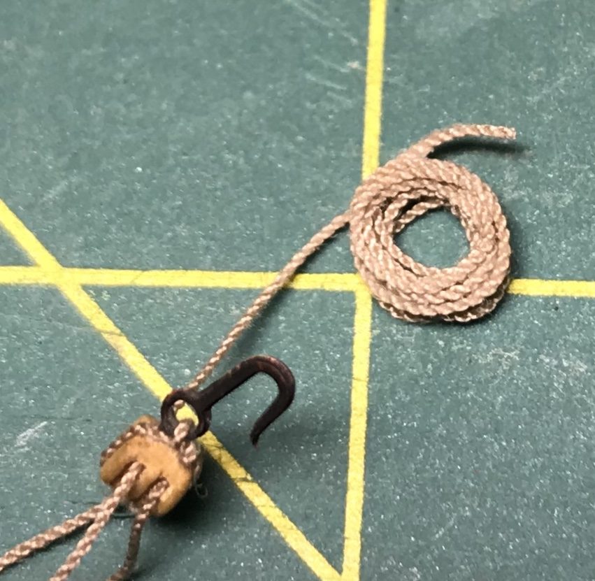 The result: a coiled 0.3 mm tackle line with a hole in the middle and some height in the pile, next to the block with hook.
