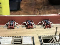 A row of rigged guns from above