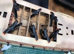 Gun deck with anchor cable and messenger, while the upper deck beams are being glued