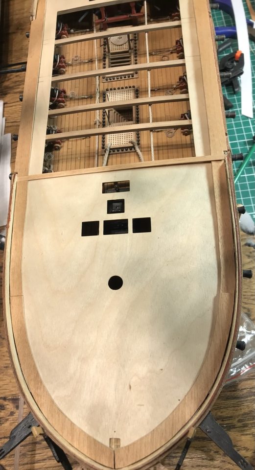 The bare plywood upper deck, still laid loose on the ship for a trial fit.