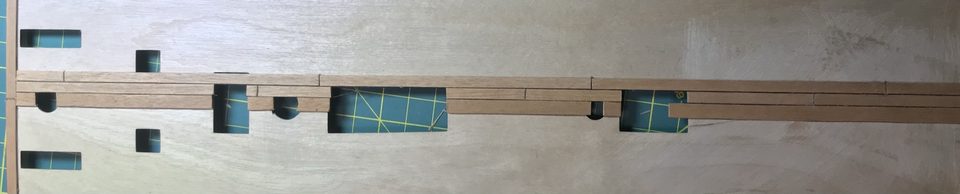 The first planks next to the king plank, with the thread seams.