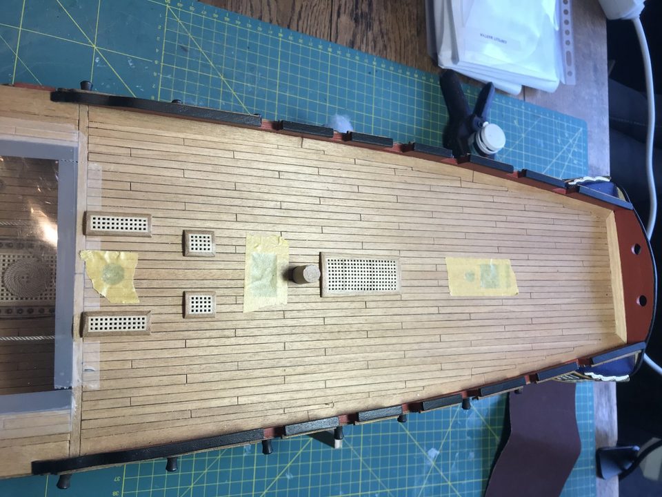 The gratings fitted, apart from the large grating abaft the capstan