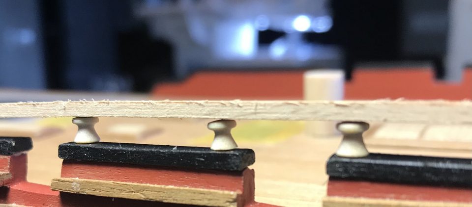 First version of the turned pillars for the rail aft