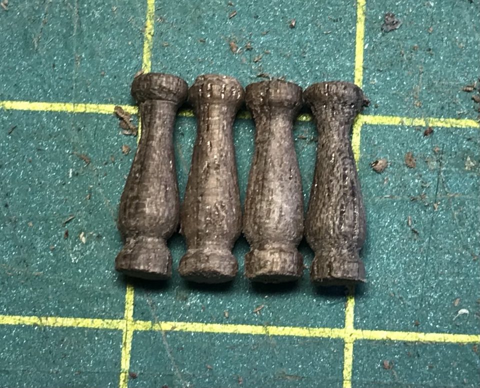 The four stanchions side by side on the cutting mat for comparison.