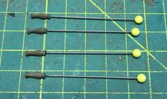 The stanchions with the pins in the bottom, not yet cut short