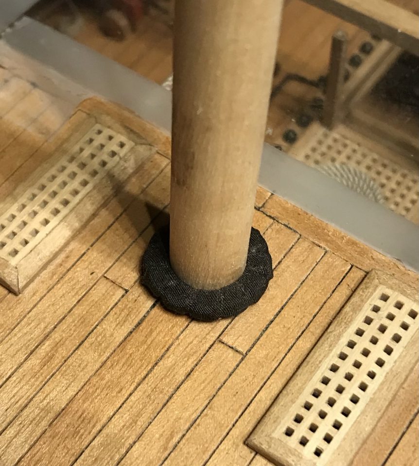 The mast coat with the black cloth stretched over it