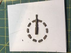 Set-up for the ship's wheel: the bits of wood in a circle on the jig, with a trial spoke