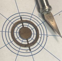 The wheel with one spoke on the spider's web that is meant to help with alignment
