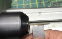 The pre-shaped blade against the turning strip