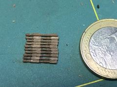 The ten spokes next to a euro coin