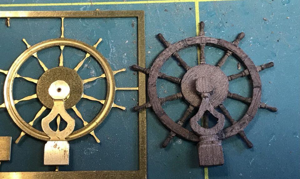 The brass wheel with stanchion from the kit next to the home-made wheel with stanchion