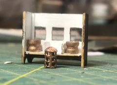 The open binnacle with the lantern and the two compasses in front of it