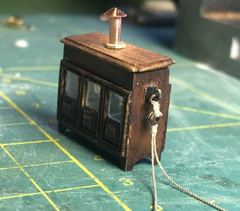 The binnacle with chimney and the first lashing rope