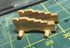 The cheeks on the axletrees, with the first small ring at the end of the front axletree