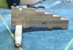 The cheek with the first cap-square and the cap-square pin