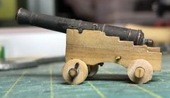 The gun on the carriage tilts aft
