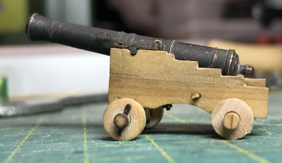 The gun on the carriage tilts aft