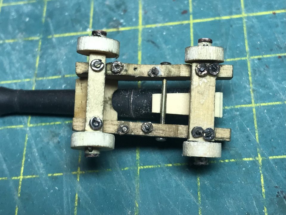The underside of the carriage: the pins pass through the cheeks and are secured with small rings.