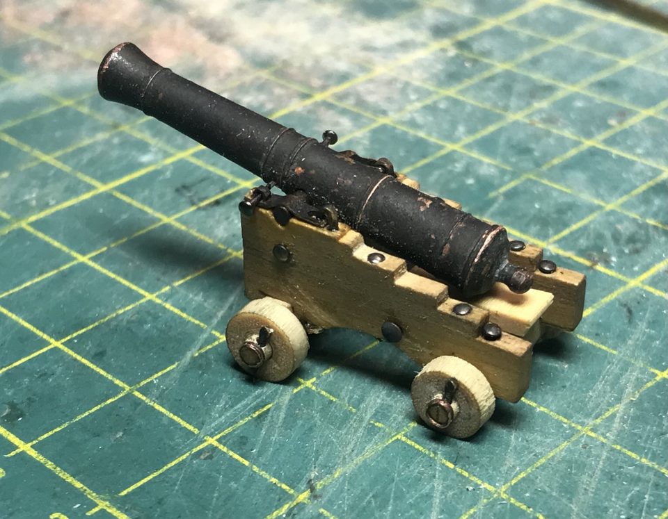 The first scratch-built gun carriage with the 9-pounder on it: crisp stepped cheeks, a higher front axletree and the trucks with their small rings.