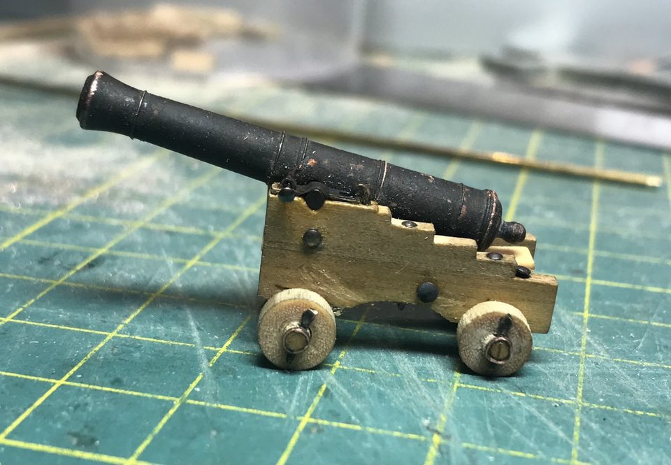 The complete carriage from the side: cheeks, axletrees, trucks and pins hold together without glue.