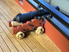 The first 9-pounder on its gun carriage, still without a handle on the quoin and without rigging
