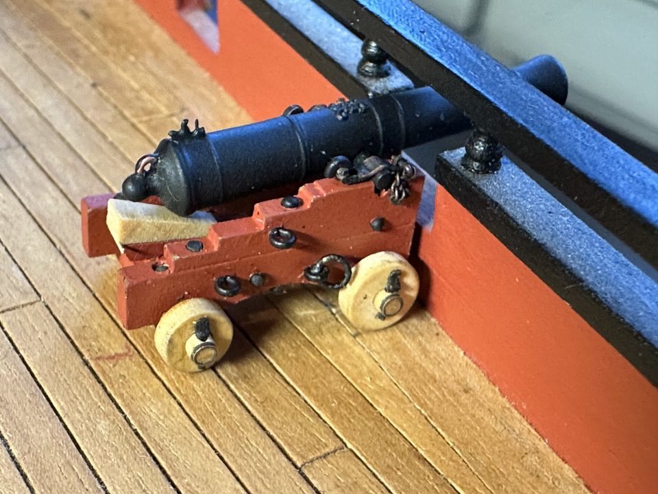 The first 9-pounder on its gun carriage, still without a handle on the quoin and without rigging