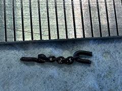 The little chain next to a ruler, each mark is 1 mm